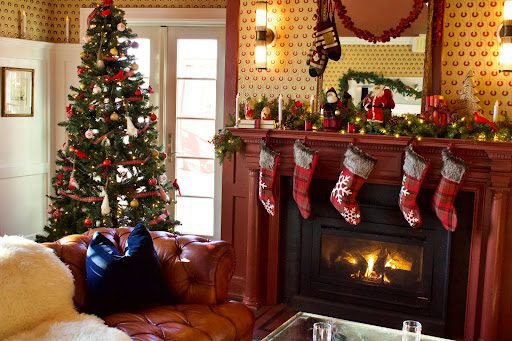 Christmas decorations: stockings on the mantle, fire, Christmas tree